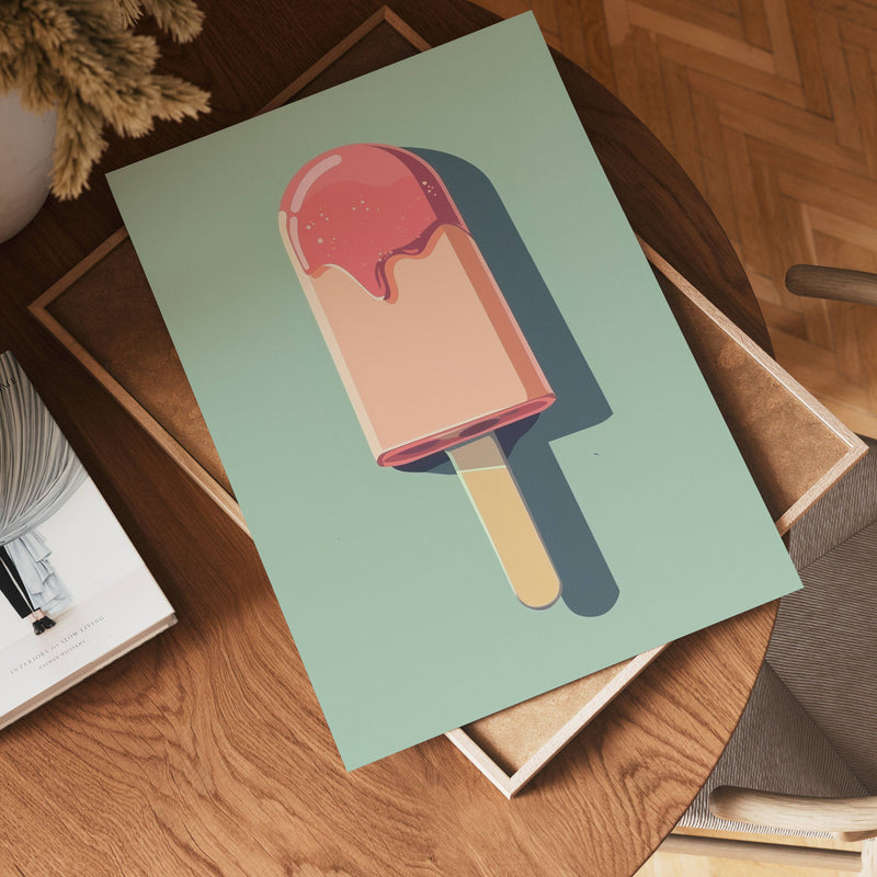 The no-9 green poster, featuring a vibrant popsicle with pink topping, rests on a wooden table beside a book and tray in a warmly lit room with herringbone wood flooring.