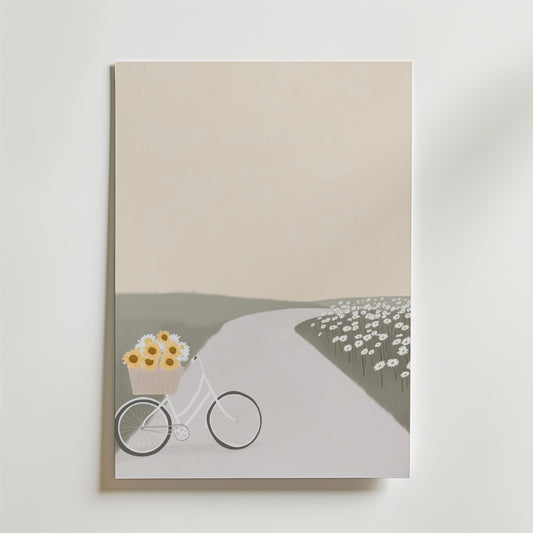 Magnolia Whisper Poster by Bozetto: En minimalistisk design med en cykel och solrosor på en slingrande stig i ett fält av vita blommor under en mild himmel, tryckt på premiumpapper för en harmonisk atmosfär.
