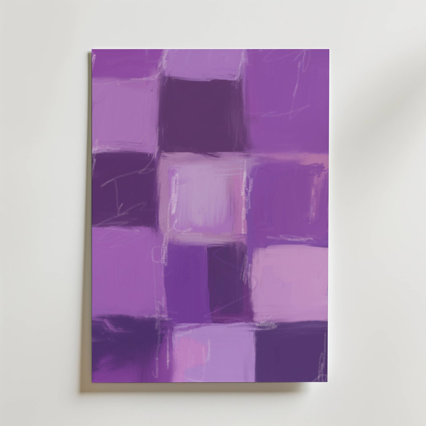 Wabi Harmony Poster från Bozetto har en abstrakt komposition av lila och violetta rutor som fångar japansk enkelhet och ger en rogivande accent till skandinavisk inredning när den hänger på en vit vägg.