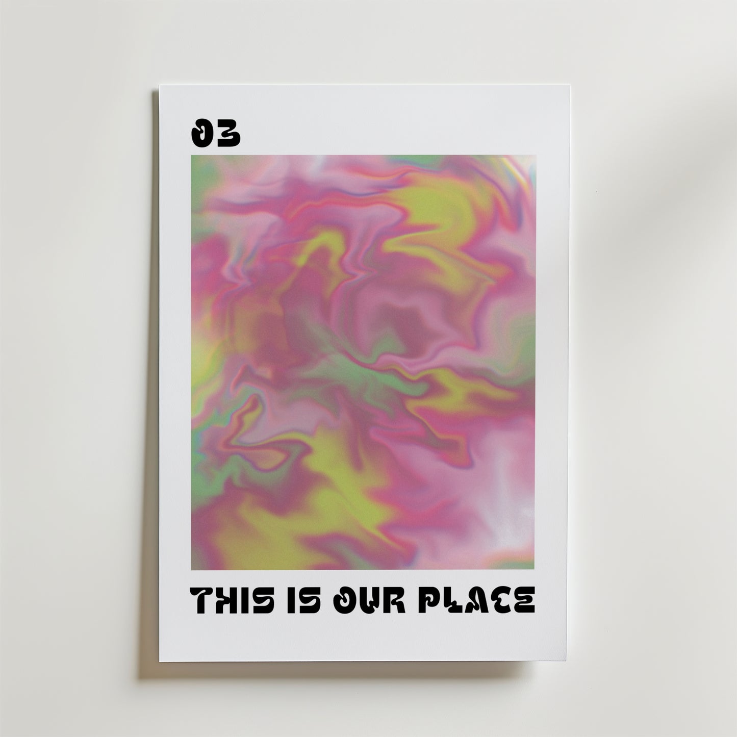 This Is Our Place Poster av Bozetto har djärva, abstrakta virvlar i rosa, gult och grönt, med "03" längst upp till vänster och "THIS IS OUR PLACE" längst ner - ett slående, känslomässigt motiv som passar perfekt för alla utrymmen.